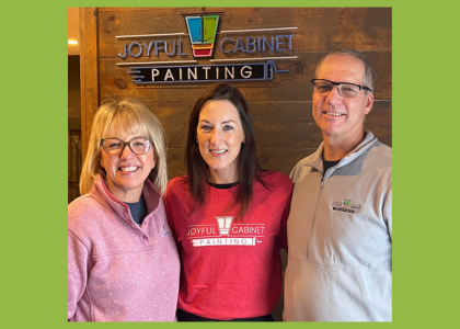 three people standing in front of the Joyful Cabinet Painting logo